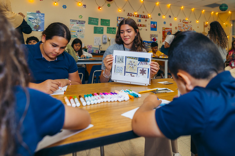 FIU instructor working with students during a Living Shorelines classroom lesson