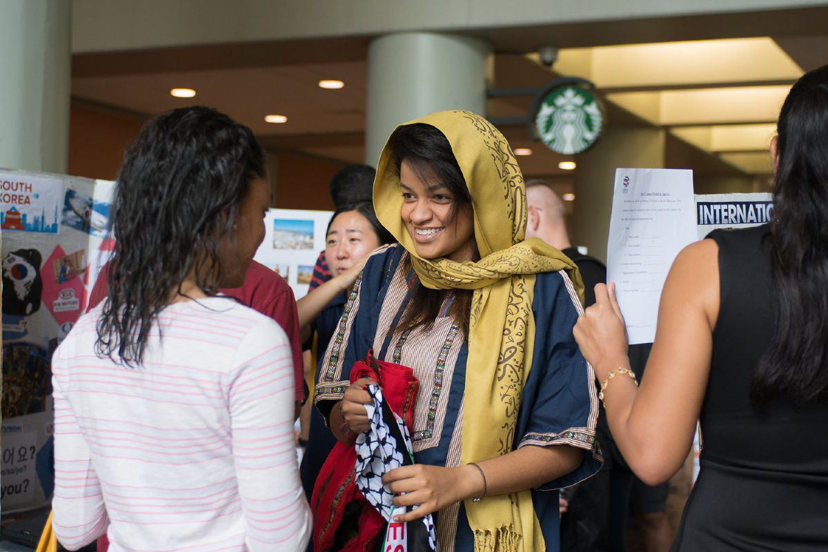 FIU students talk during heritage event